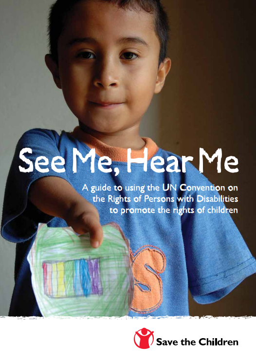 A child holds up a picture they have drawn themselves with colored stripes.
